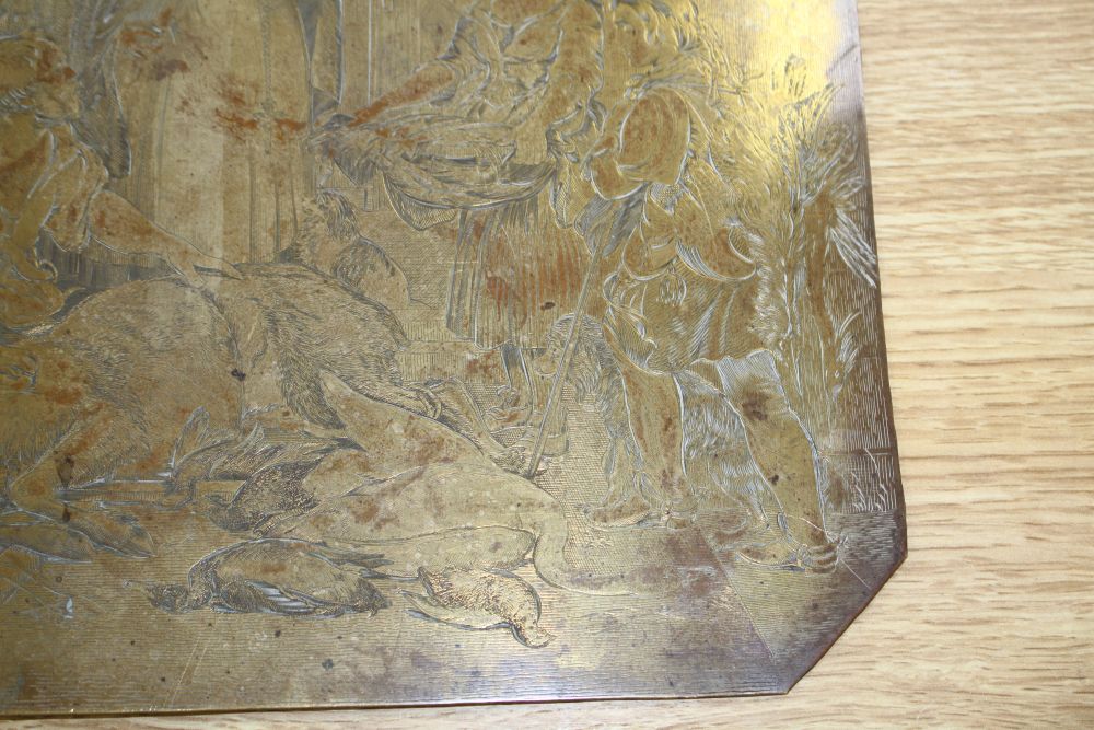 A 19th century engraved copper printing plate, probably later gilded, depicting figures around a stag